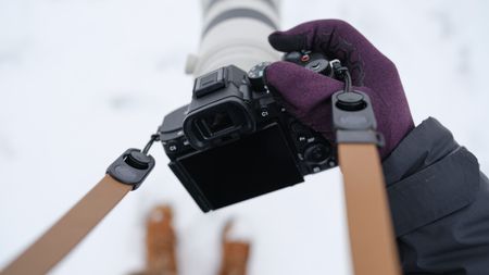 The Sony A7 V covered in snow